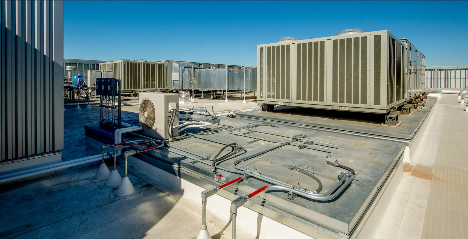 Commercial rooftop HVAC equipment and ductwork.
